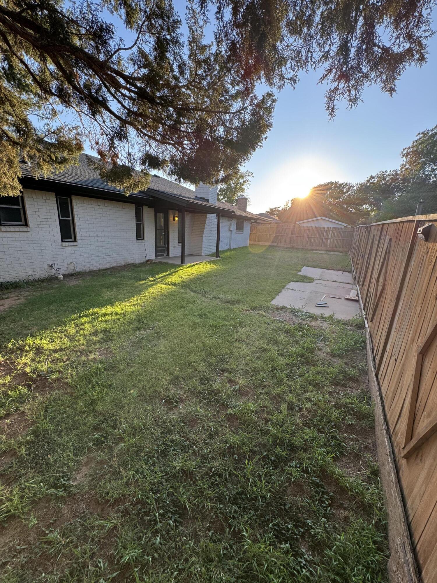 4402 78th Street Lubbock, TX 79424 - Photo 37 of 43 a backyard of a house with lots of green space