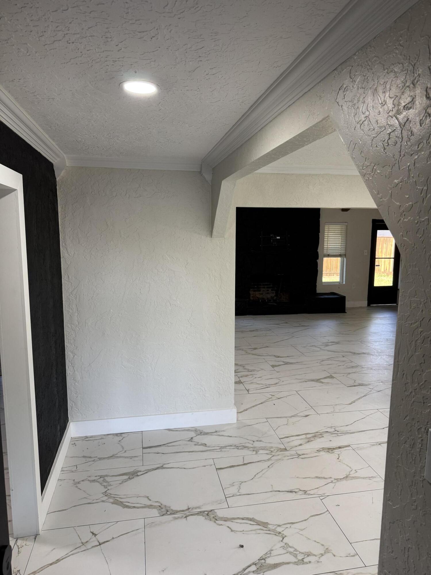 4402 78th Street Lubbock, TX 79424 - Photo 7 of 43 a view of room with a hallway