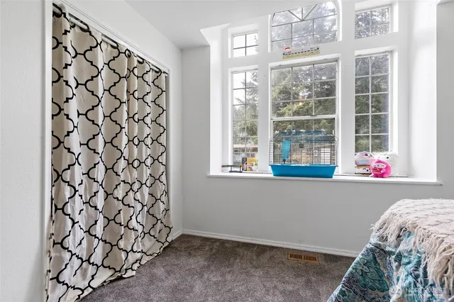 a room with a cabinet and a window