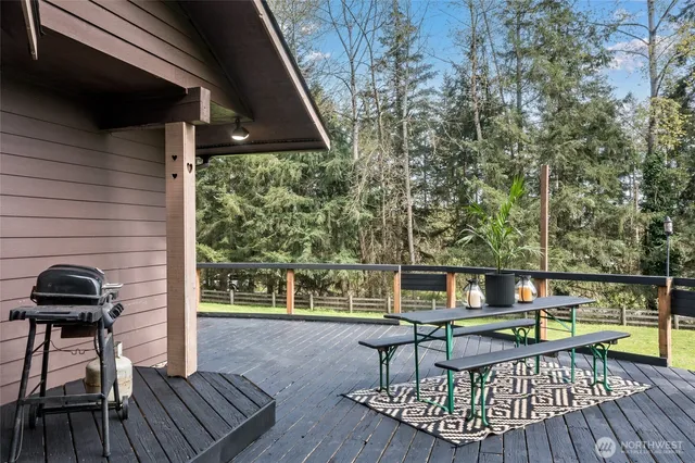a view of a chairs and table on the deck