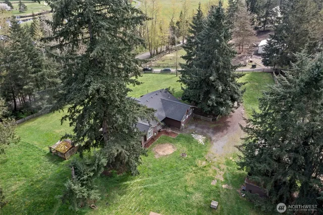 a backyard of a house with yard and lake view
