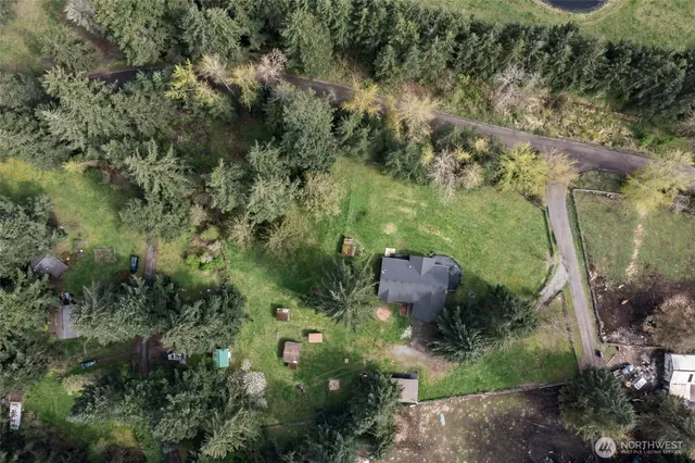 an aerial view of a house with a yard