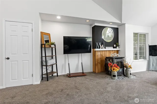 a view of a livingroom with furniture and a flat screen tv
