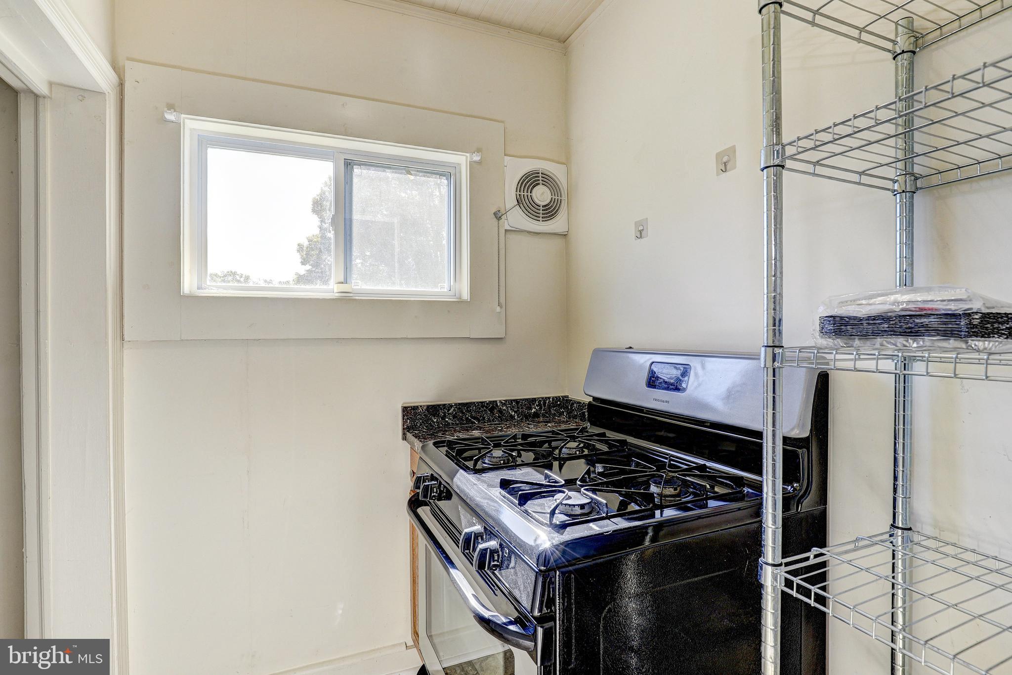 15 Ritters Lane Owings Mills, MD 21117 - Photo 13 of 30 a kitchen with a stove and a window