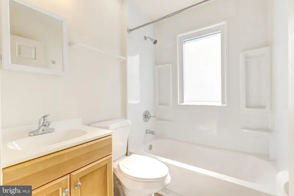 a bathroom with a sink toilet and bathtub