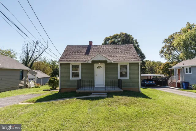 a view of house with outdoor space and swimming pool