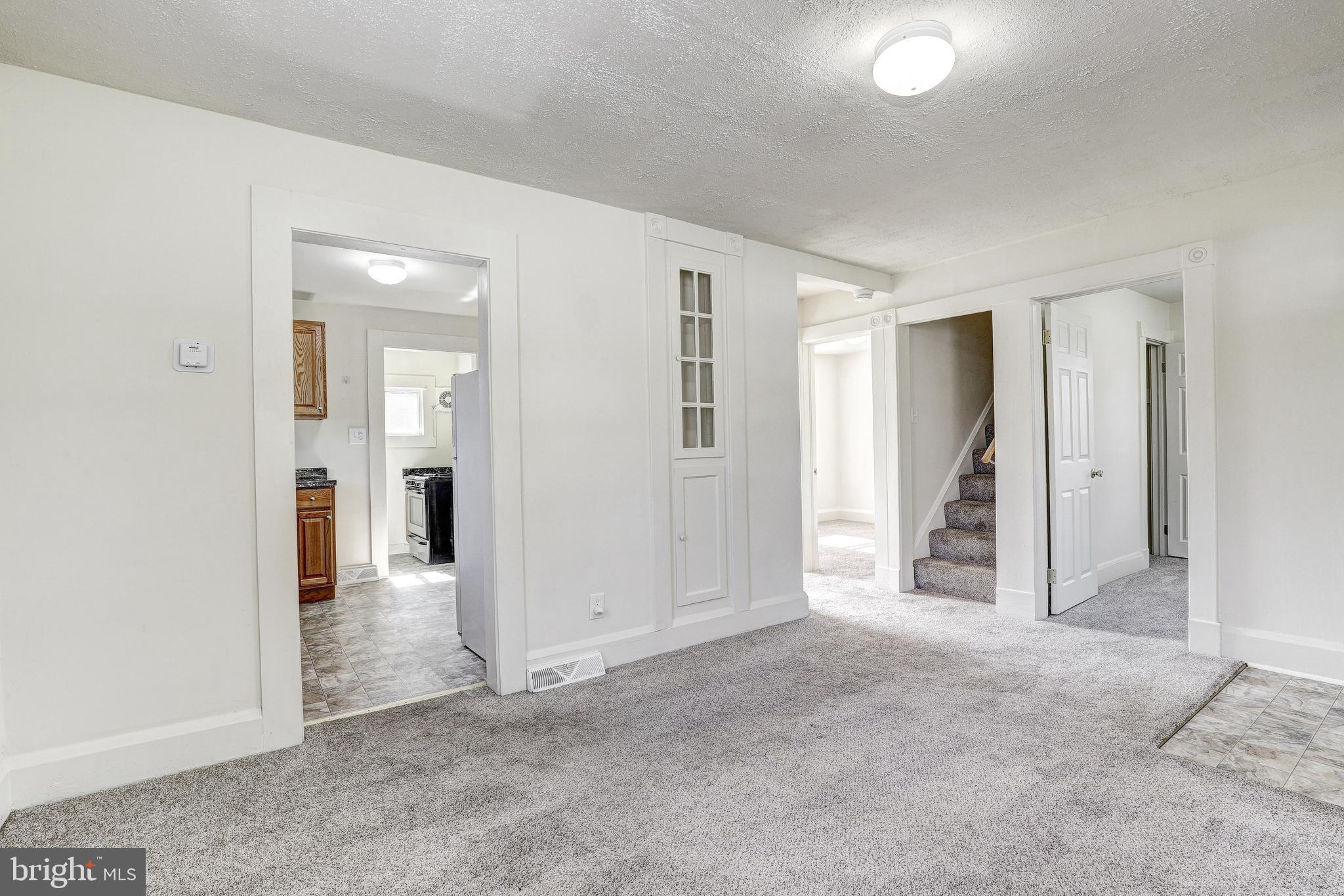 15 Ritters Lane Owings Mills, MD 21117 - Photo 10 of 30 an empty room with windows and bathroom view