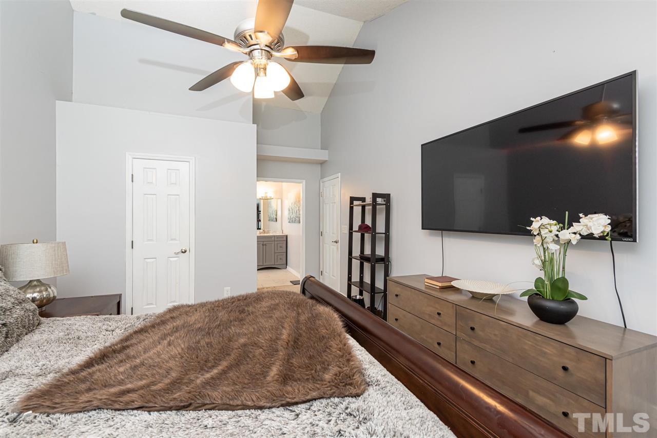 3508 Singleleaf Lane Raleigh, NC 27616 - Photo 11 of 20 a living room with furniture and a flat screen tv