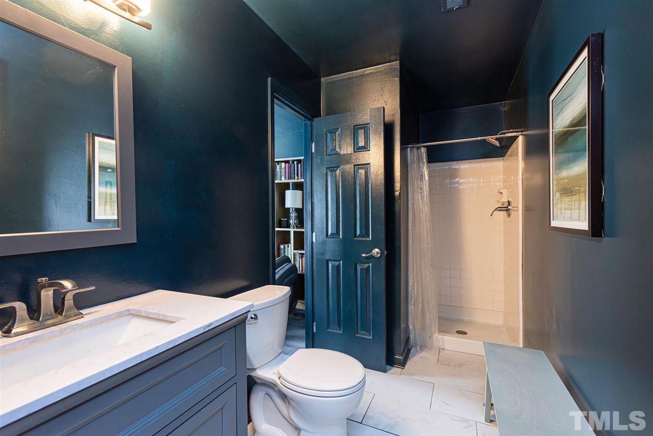 3508 Singleleaf Lane Raleigh, NC 27616 - Photo 13 of 20 a bathroom with a sink a toilet a mirror and shower