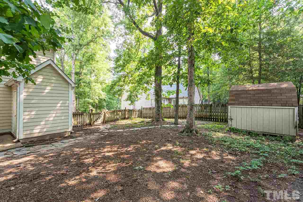 3508 Singleleaf Lane Raleigh, NC 27616 - Photo 19 of 20 a backyard of a house with lots of green space