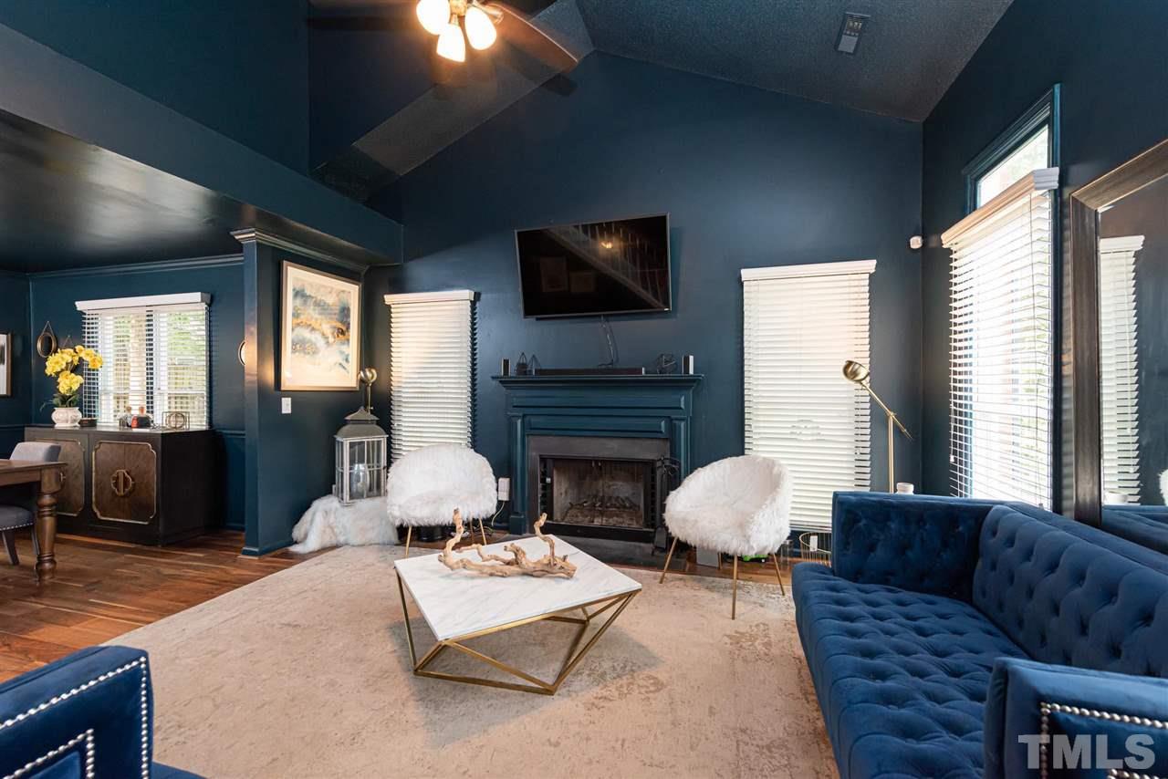 3508 Singleleaf Lane Raleigh, NC 27616 - Photo 3 of 20 a living room with fireplace furniture and a flat screen tv