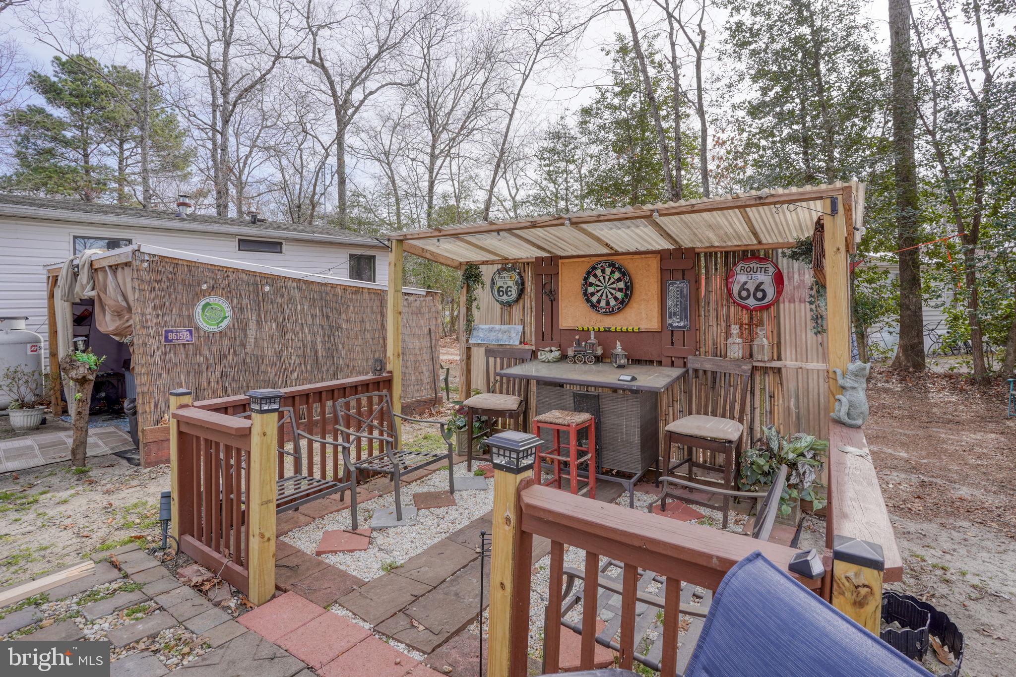 15450 Weigela Drive Georgetown, DE 19947 - Photo 14 of 37 Charming outdoor retreat with bar.