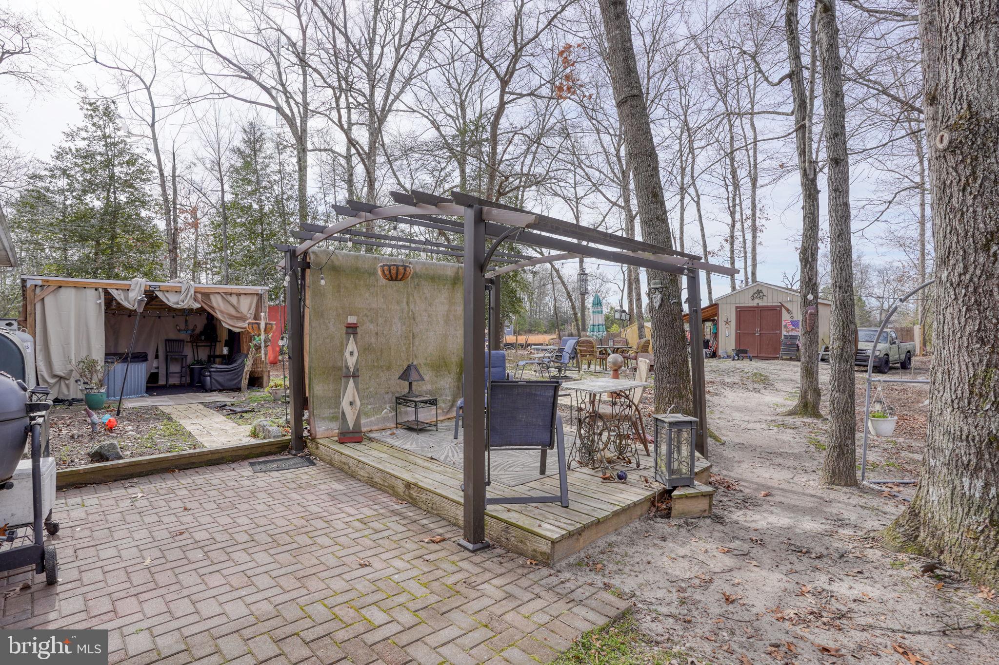 15450 Weigela Drive Georgetown, DE 19947 - Photo 16 of 37 Charming outdoor retreat among trees.