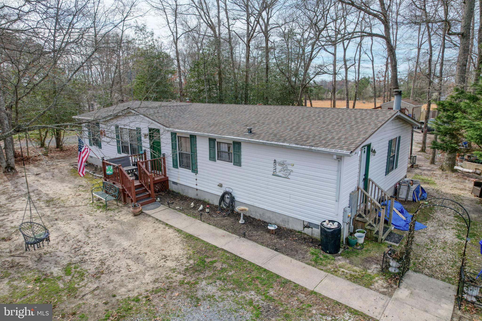 15450 Weigela Drive Georgetown, DE 19947 - Photo 2 of 37 Charming home nestled in nature's embrace.