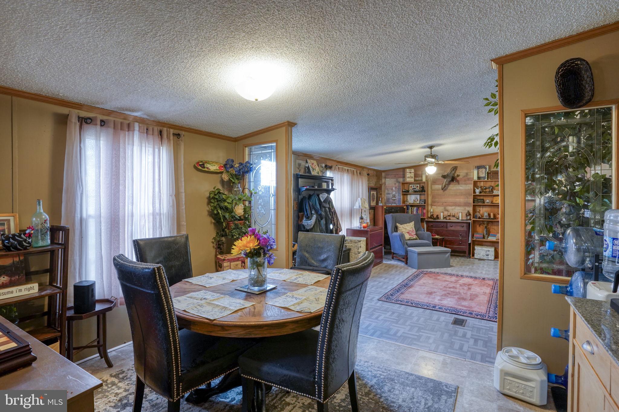15450 Weigela Drive Georgetown, DE 19947 - Photo 21 of 37 Cozy dining area with warm ambiance.