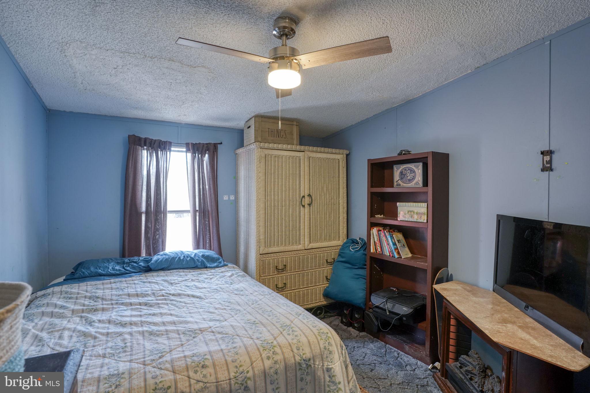 15450 Weigela Drive Georgetown, DE 19947 - Photo 30 of 37 Cozy blue-hued bedroom retreat.