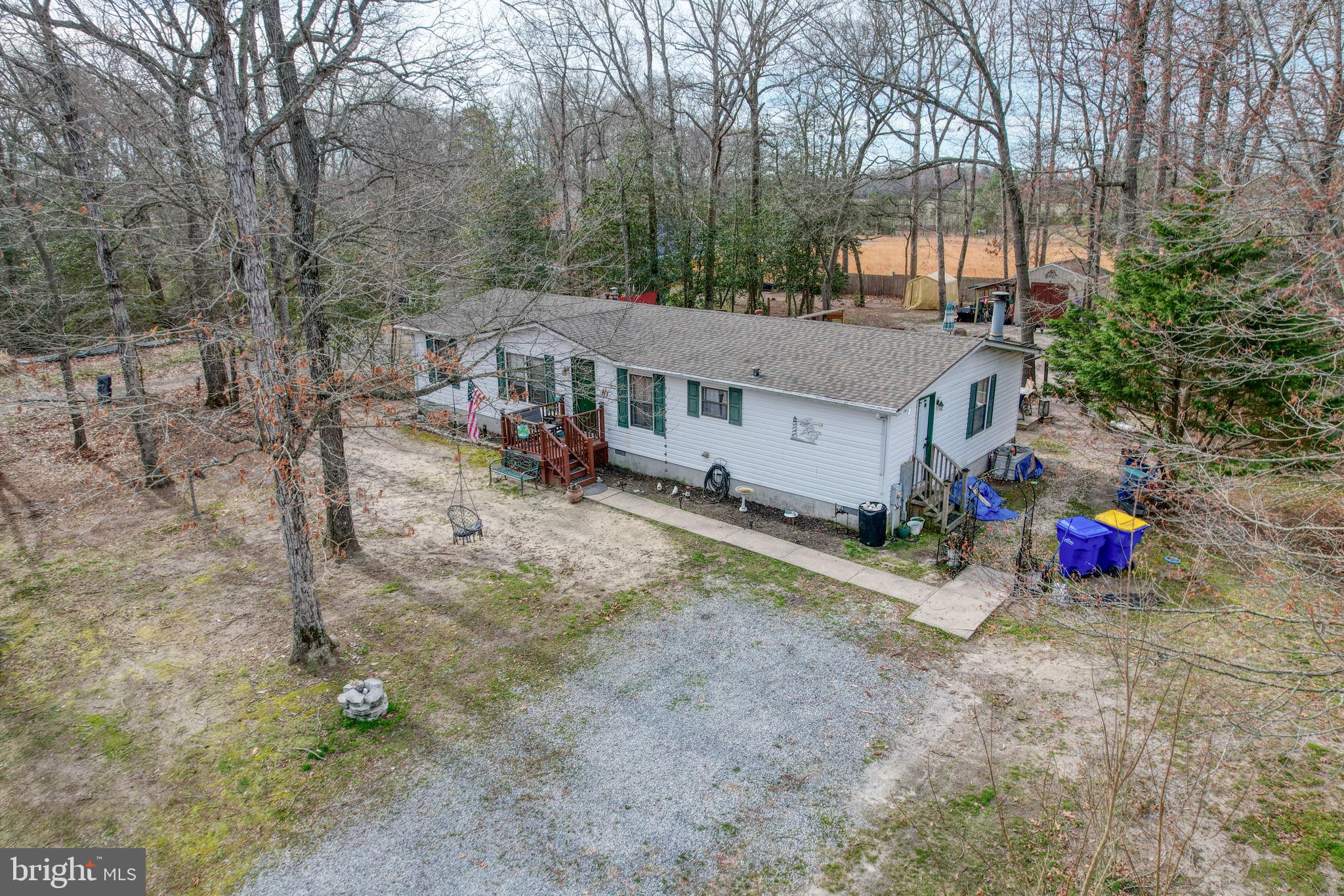 15450 Weigela Drive Georgetown, DE 19947 - Photo 3 of 37 Charming home nestled in nature's embrace.