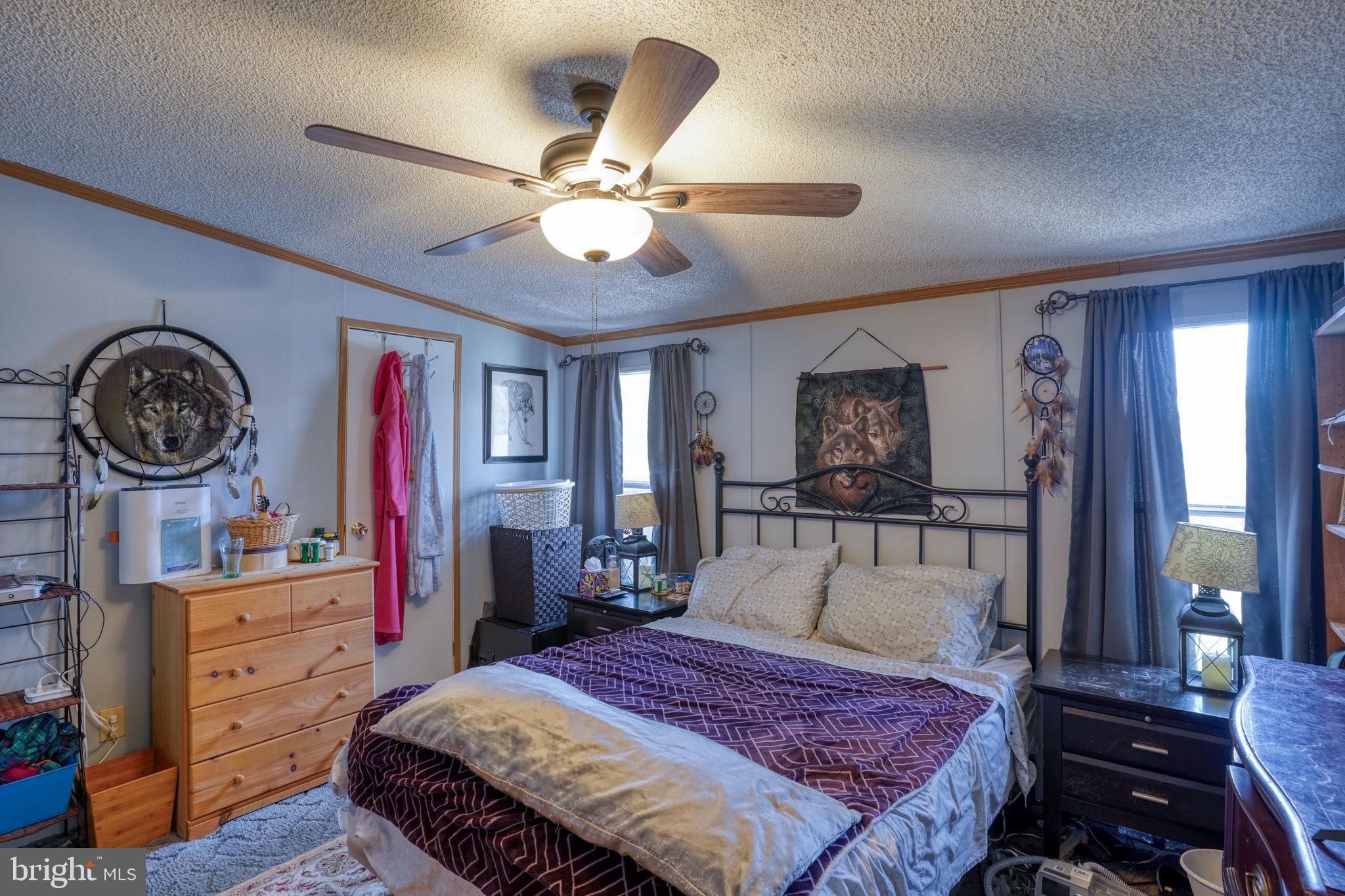 15450 Weigela Drive Georgetown, DE 19947 - Photo 34 of 37 Cozy bedroom with inviting decor.