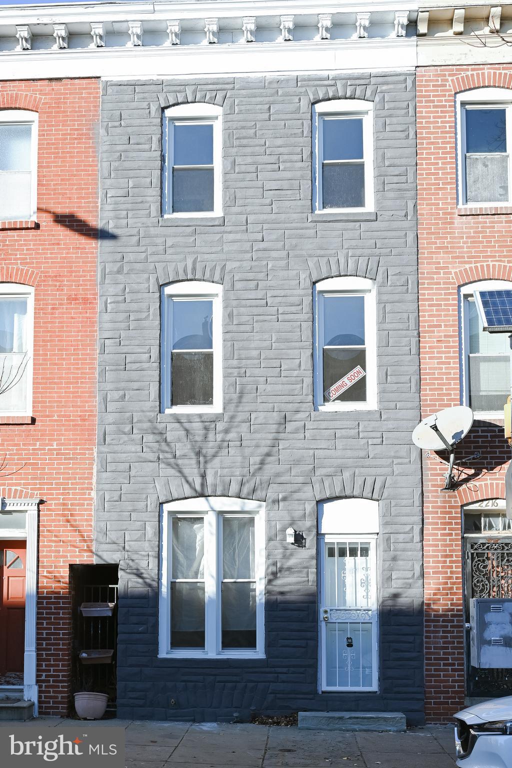 2214 East Fayette Street Baltimore, MD 21231 - Photo 2 of 40 a brick building with four windows