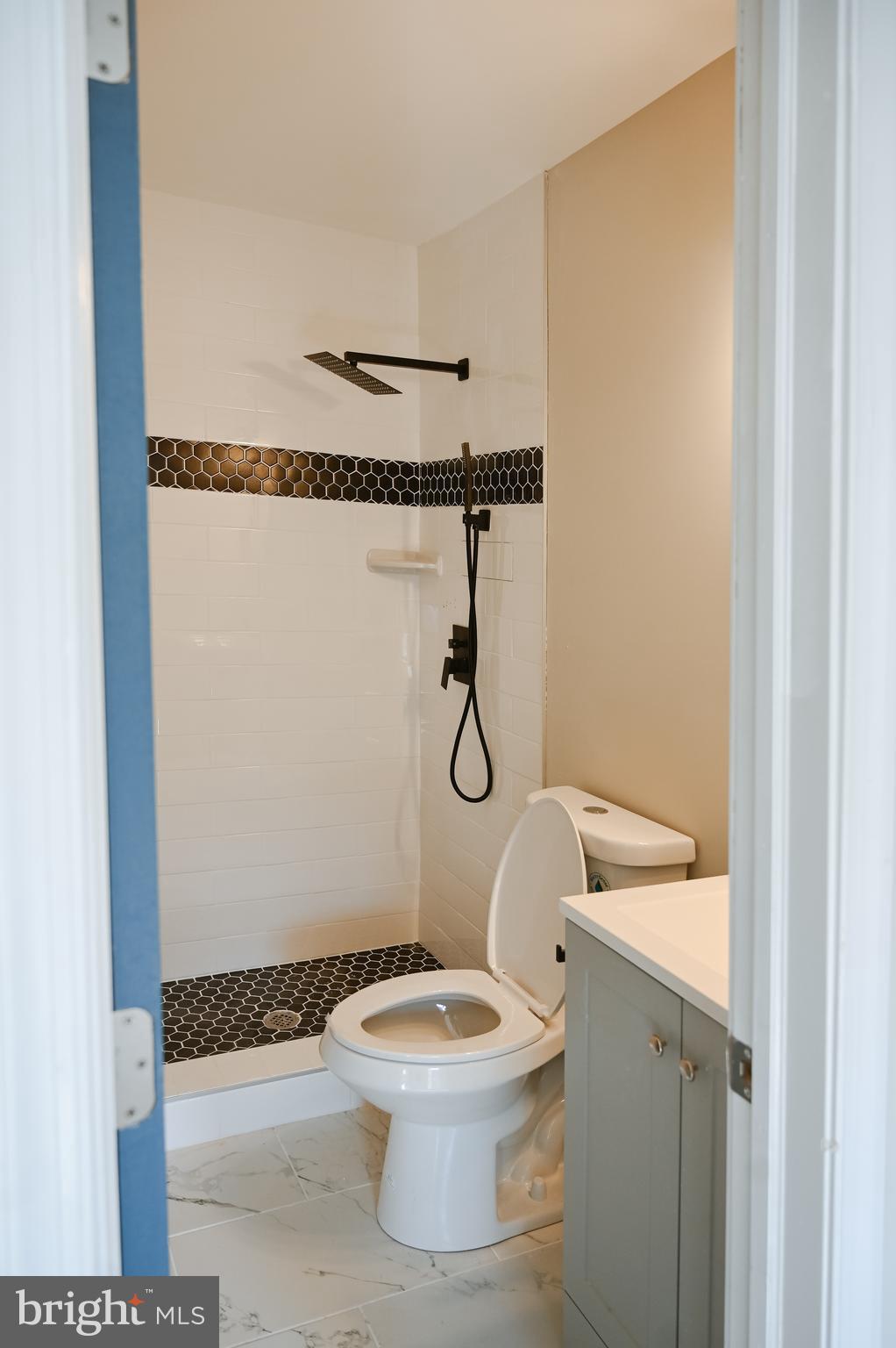 2214 East Fayette Street Baltimore, MD 21231 - Photo 24 of 40 a white toilet sitting next to a bathroom sink