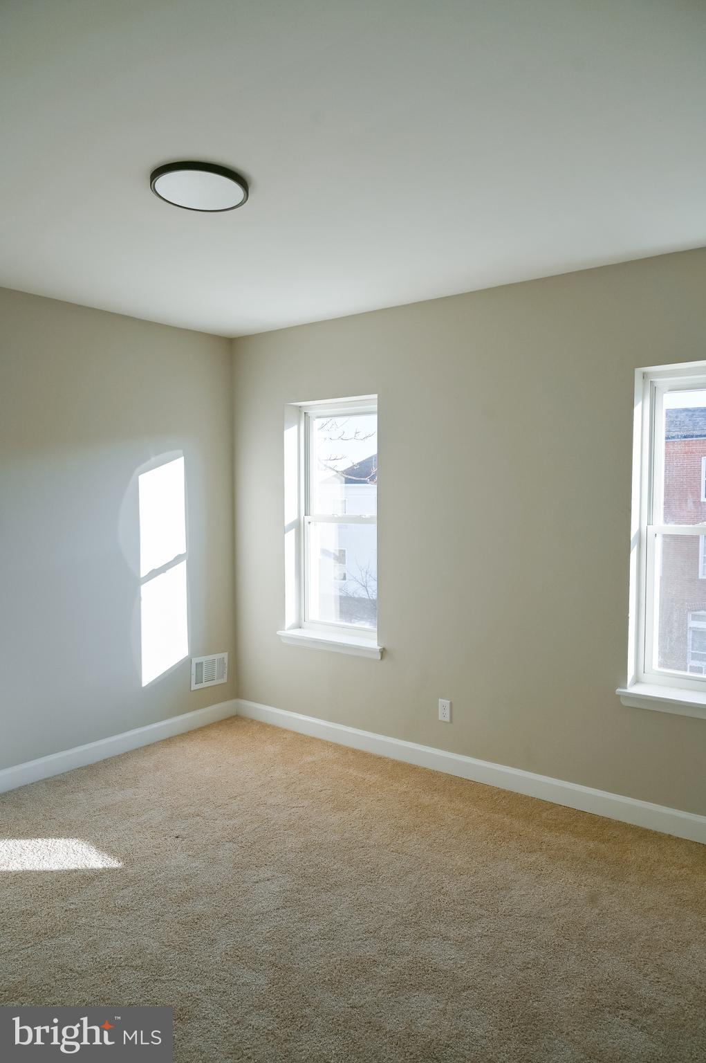 2214 East Fayette Street Baltimore, MD 21231 - Photo 33 of 40 a view of empty room with window
