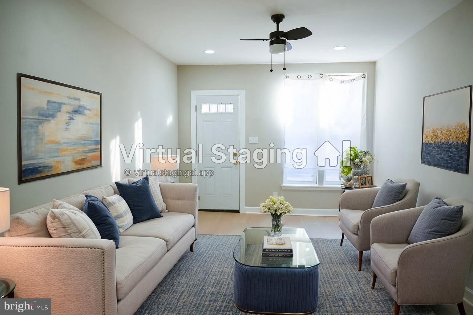 2214 East Fayette Street Baltimore, MD 21231 - Photo 4 of 40 a living room with furniture and a large window