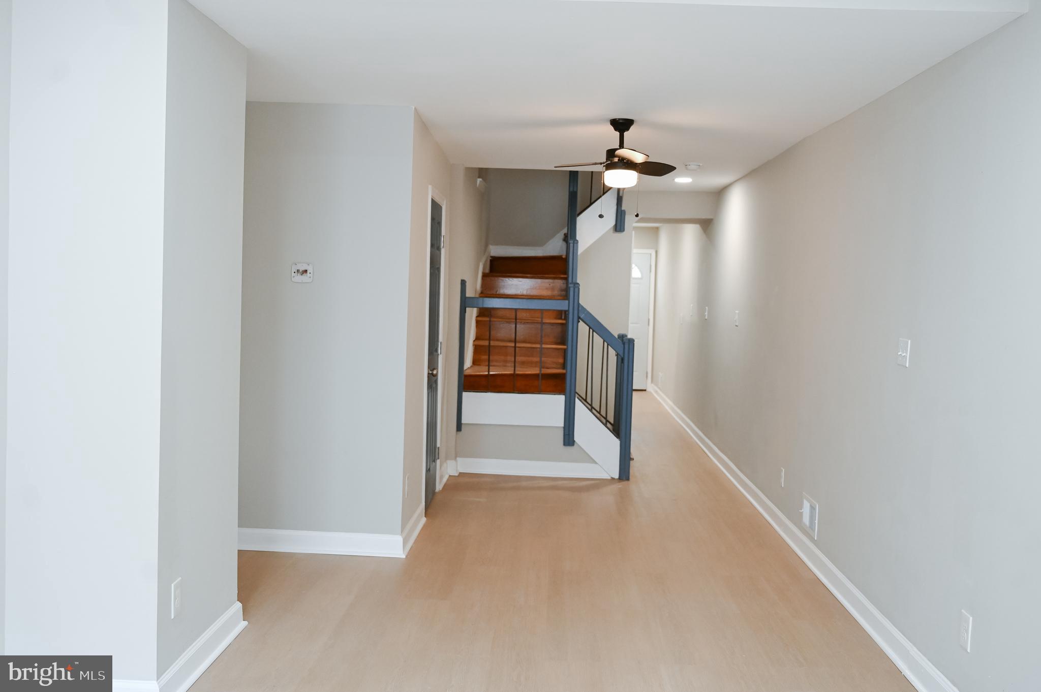 2214 East Fayette Street Baltimore, MD 21231 - Photo 7 of 40 a view of a hallway with a chandelier