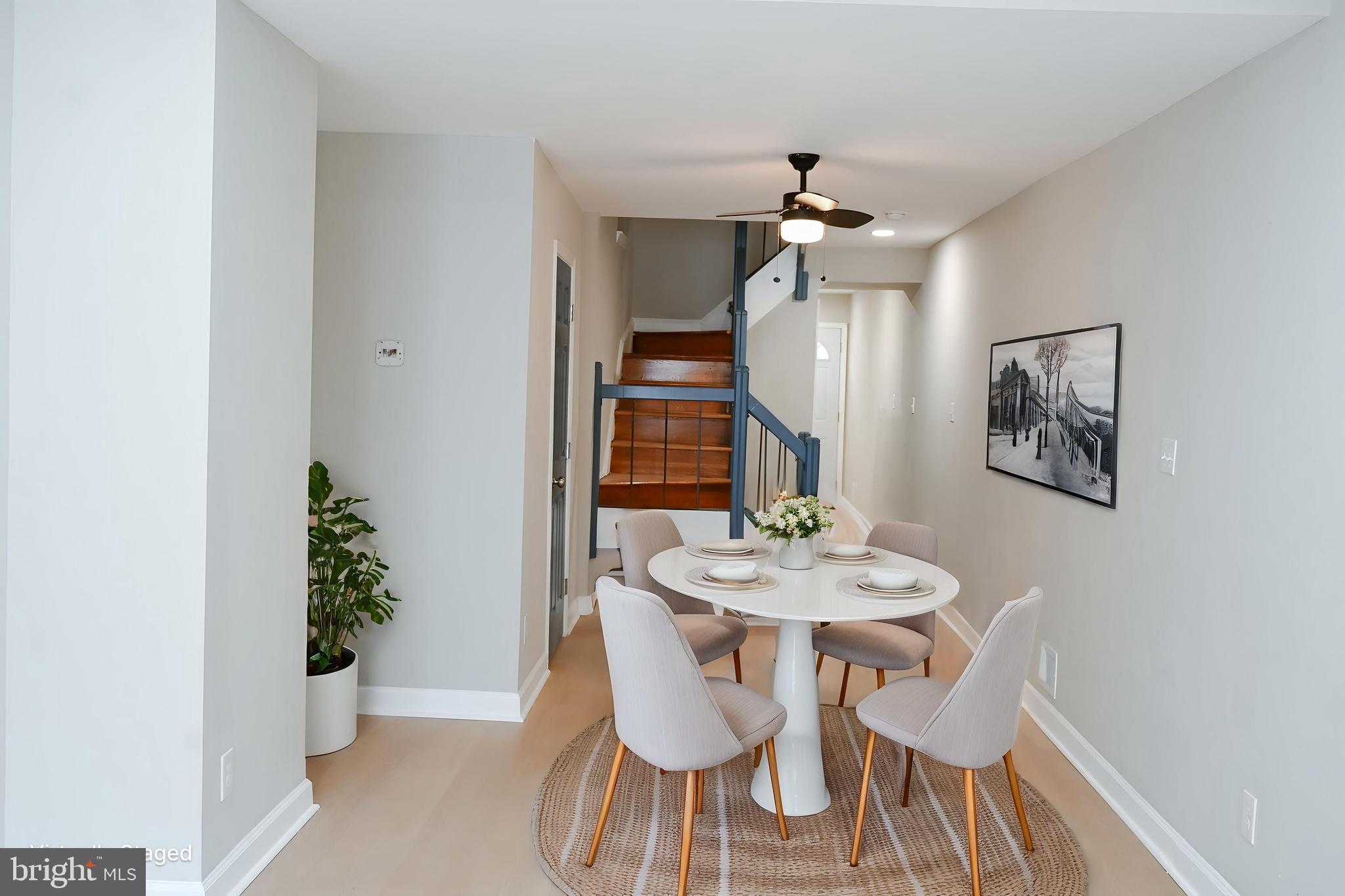 2214 East Fayette Street Baltimore, MD 21231 - Photo 9 of 40 a dining room with furniture and wooden floor