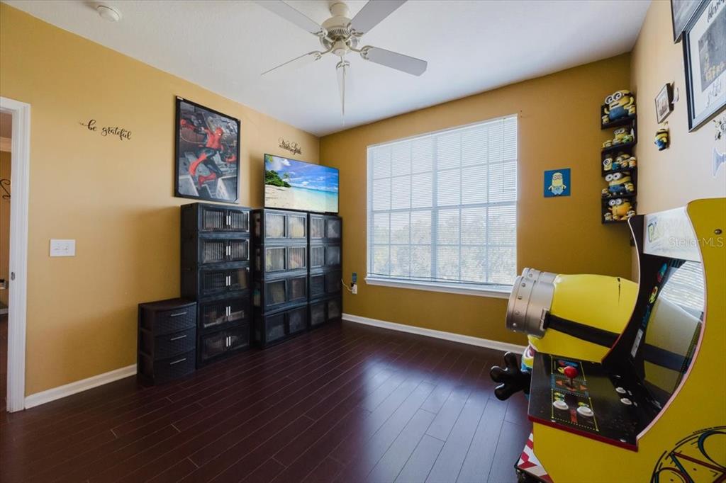 12849 Madison Pointe Circle, Unit 307 Orlando, FL 32821 - Photo 15 of 25 a view of a workspace with furniture and a window