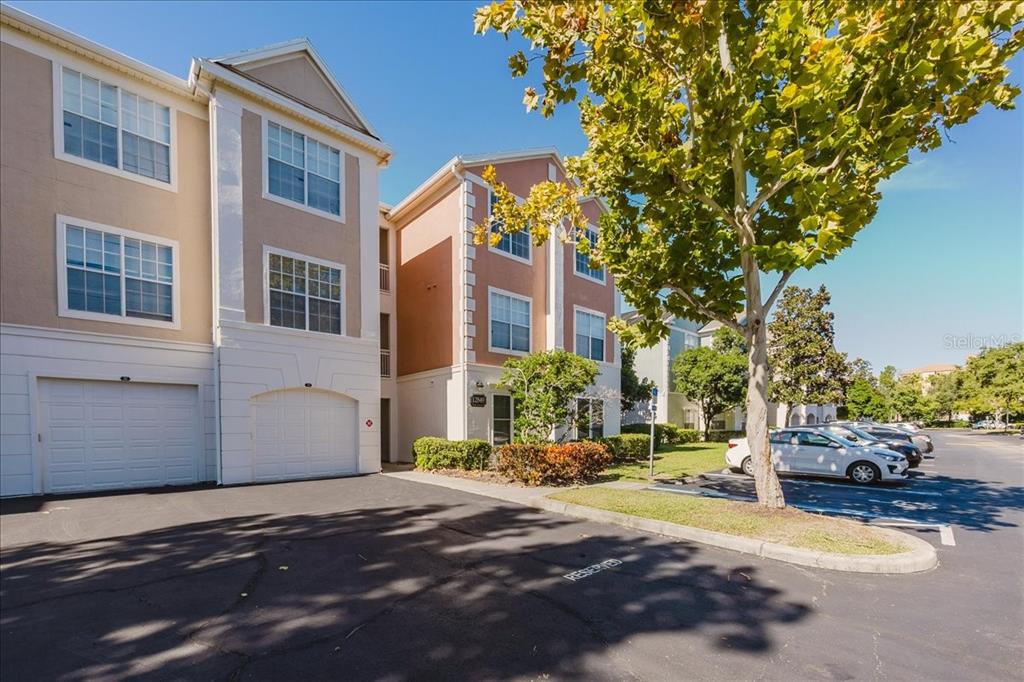 12849 Madison Pointe Circle, Unit 307 Orlando, FL 32821 - Photo 2 of 25 a view of a building with a street