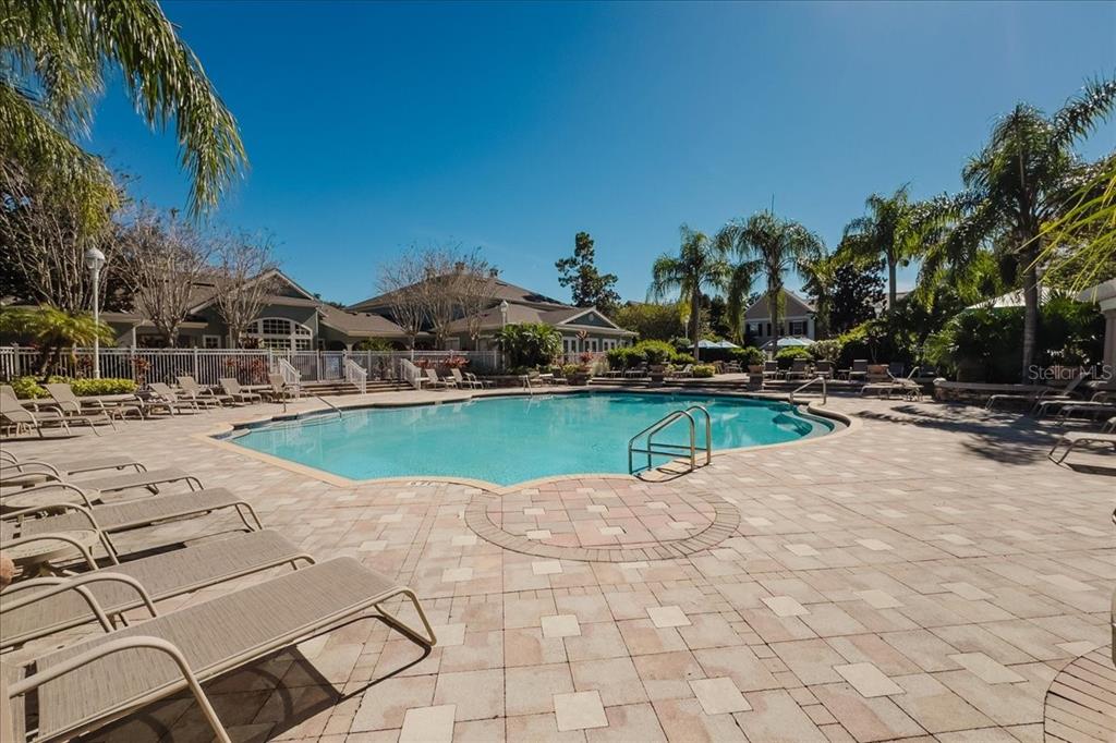 12849 Madison Pointe Circle, Unit 307 Orlando, FL 32821 - Photo 24 of 25 a view of outdoor space swimming pool and green space