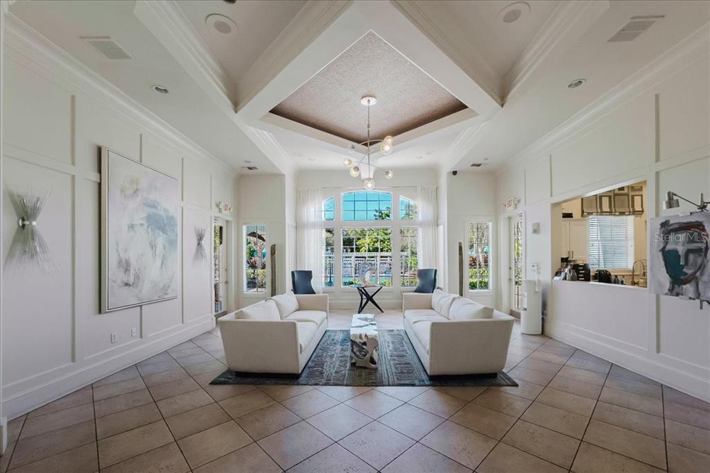 12849 Madison Pointe Circle, Unit 307 Orlando, FL 32821 - Photo 25 of 25 a living room with furniture and a flat screen tv