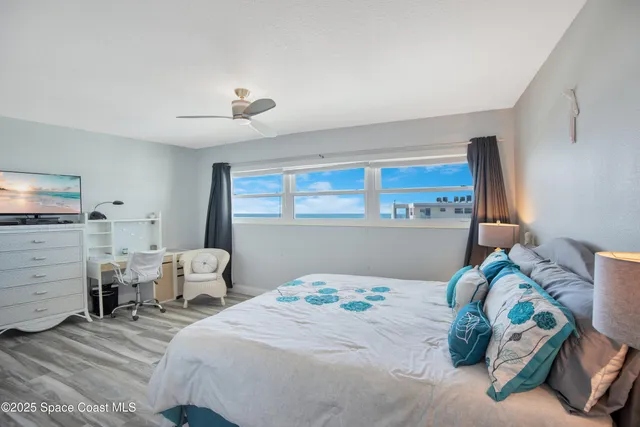 a bedroom with bed and a window