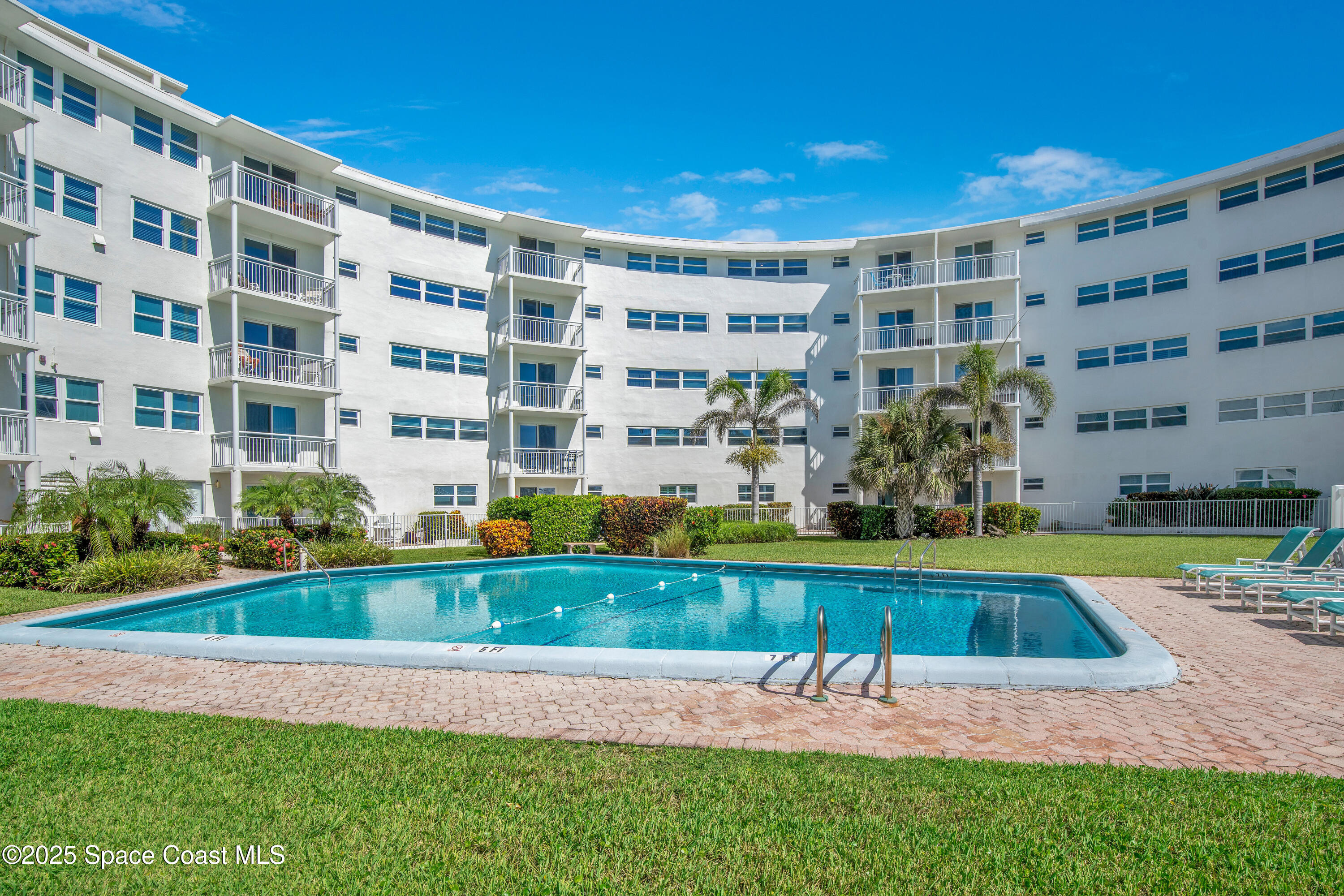 4000 Ocean Beach Boulevard, Unit 5C Cocoa Beach, FL 32931 - Photo 17 of 32 a view of building with yard