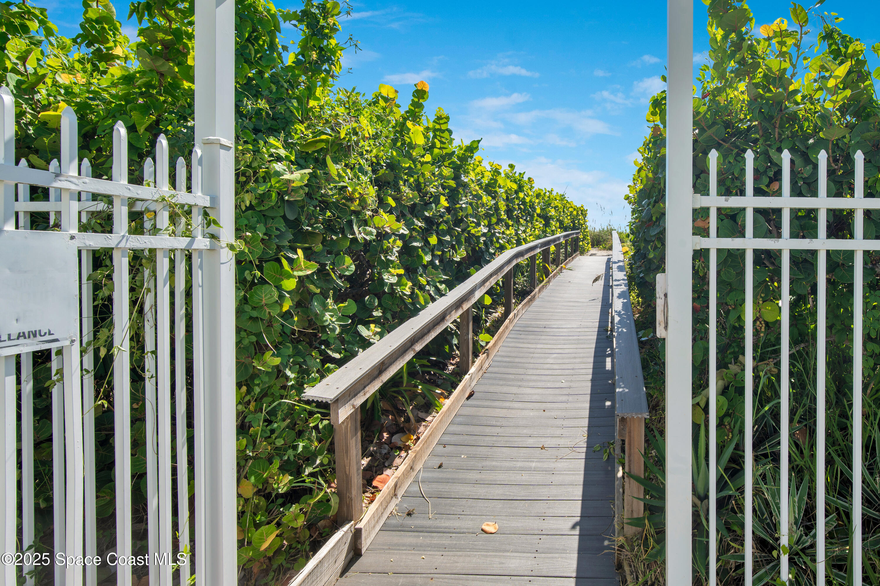 4000 Ocean Beach Boulevard, Unit 5C Cocoa Beach, FL 32931 - Photo 20 of 32 a view of a balcony with wooden floor