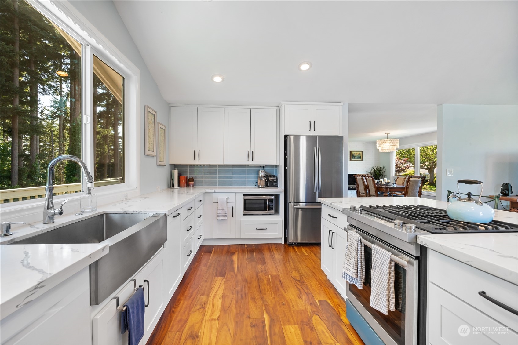 405 Parkridge Road Bellingham, WA 98225 - Photo 13 of 36 a kitchen with stainless steel appliances granite countertop a stove a sink dishwasher a refrigerator and a oven with wooden floor