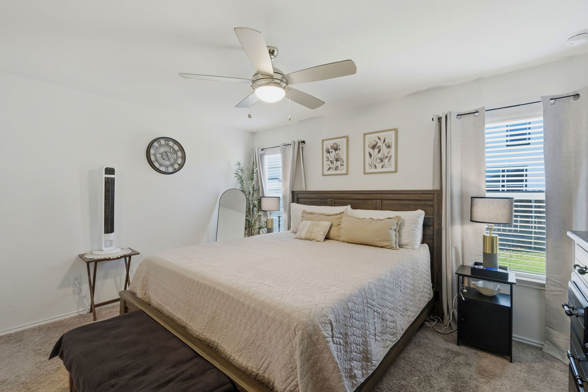 220 Lucky Texan Road Jarrell, TX 76537 - Photo 8 of 19 Relax in comfort within this well-lit bedroom featuring a ceiling fan and plush carpet.
