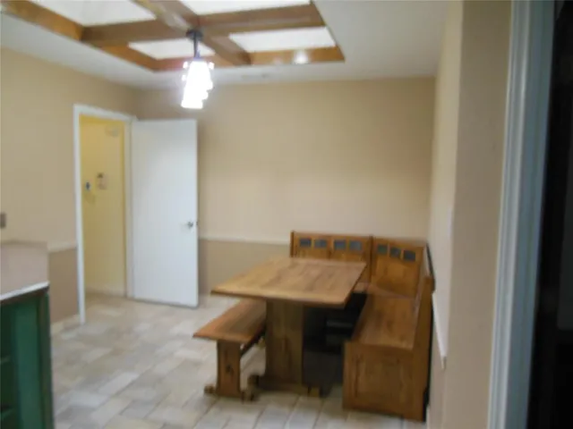 a view of a workspace with furniture