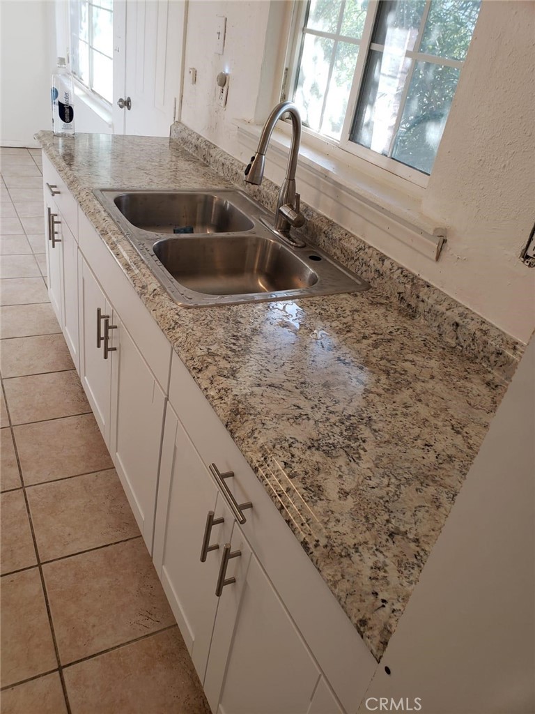 13345 Mesquite Road, Unit 2 Whitewater, CA 92282 - Photo 2 of 12 a kitchen with a sink and a stove