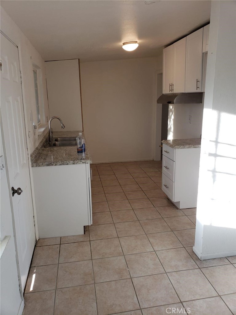 13345 Mesquite Road, Unit 2 Whitewater, CA 92282 - Photo 4 of 12 a kitchen with a sink and cabinets