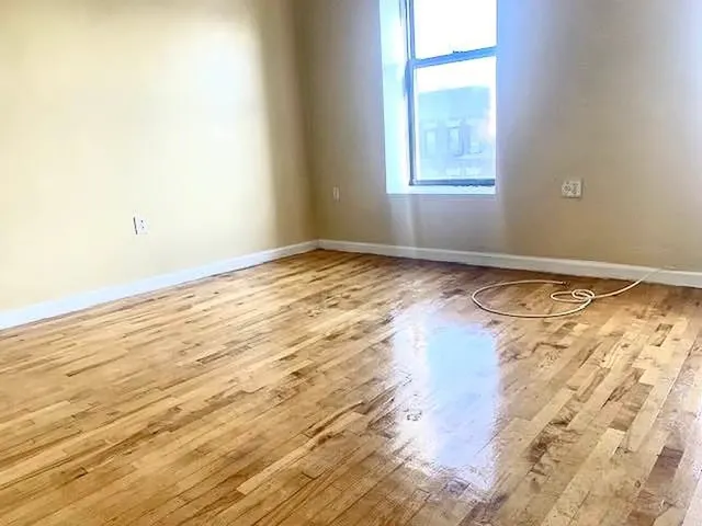 a view of an empty room and window