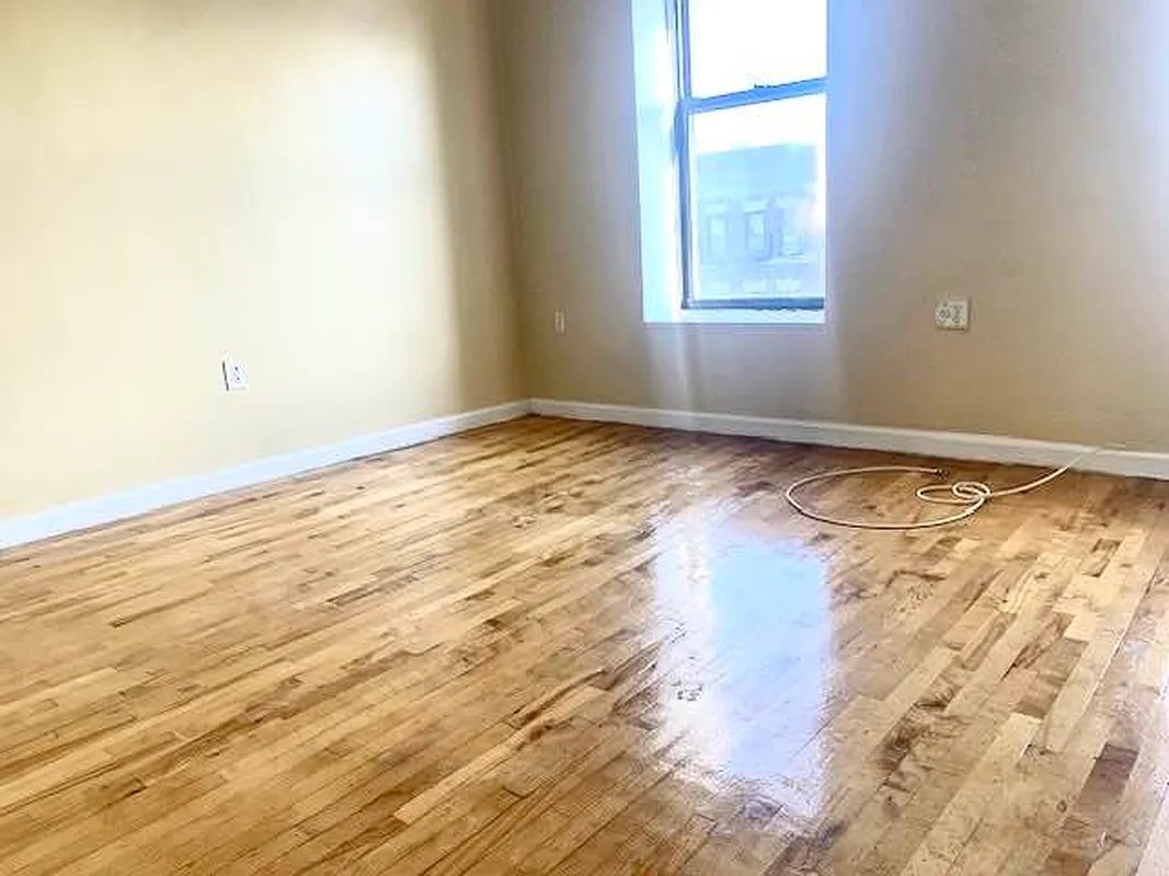 2102 Amsterdam Avenue, Unit 5C Manhattan, NY 10032 - Photo 4 of 5 a view of an empty room and window