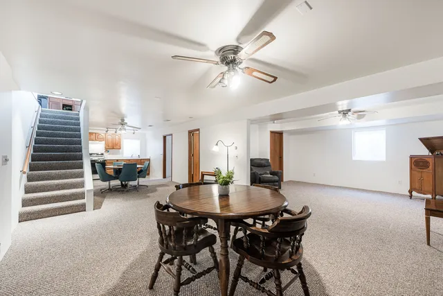 a view of a dining room with furniture and a livingroom