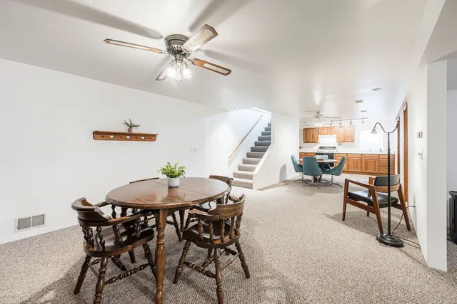 a dining room with furniture and window