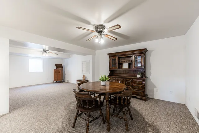 a dining room with furniture and window