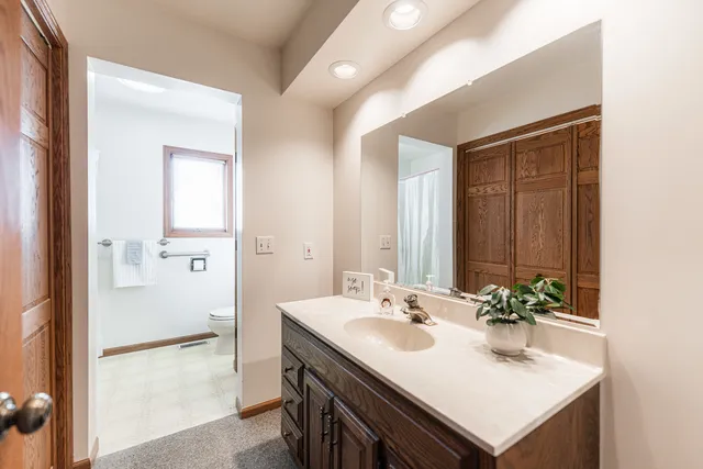 a bathroom with a sink double vanity and a mirror