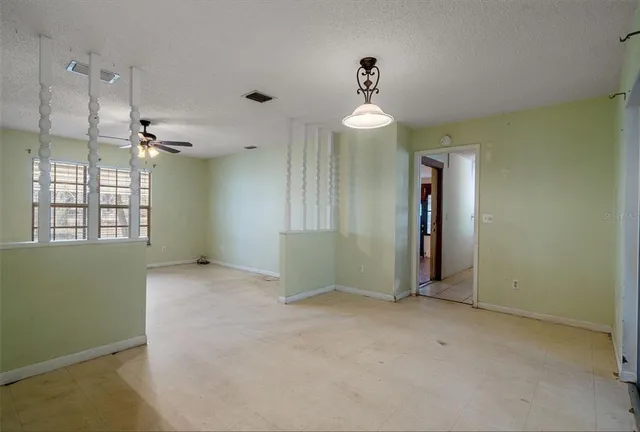 a utility room with cabinets washer and dryer