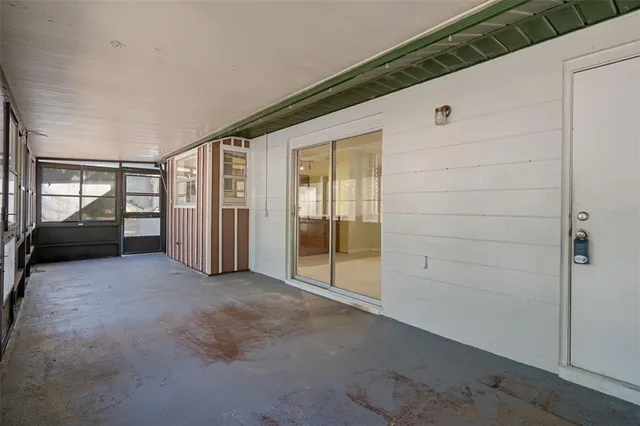 a view of a house with a wooden deck