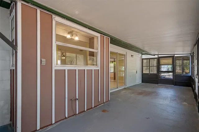 a view of house with backyard space and balcony