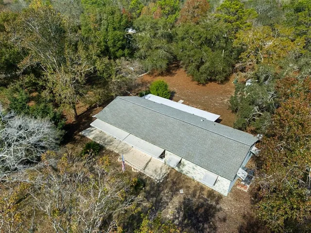 a backyard of a house with iron fence